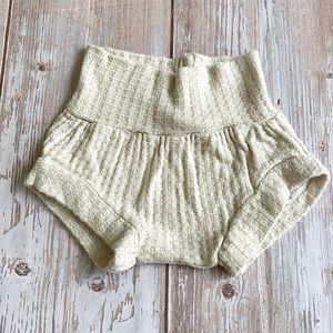 Cream baby bloomers.